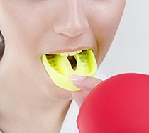 person wearing yellow mouthguard 
