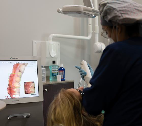 Dental team member capturing digital bite impressions